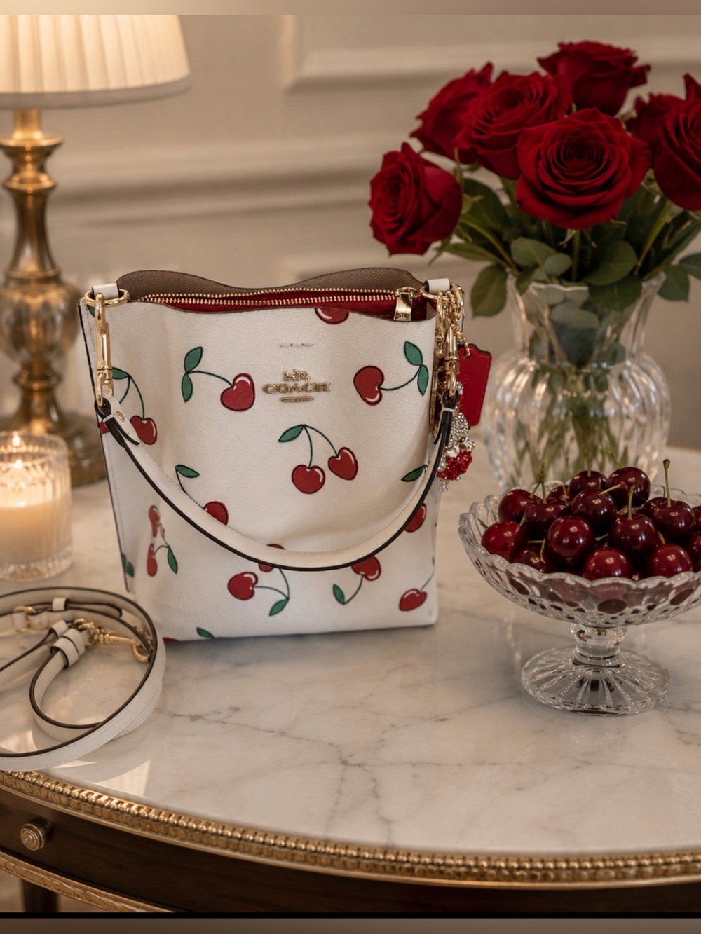 Coach White Cherry Print Leather Bucket Bag with Red Accents.Comes with  gifts.😍